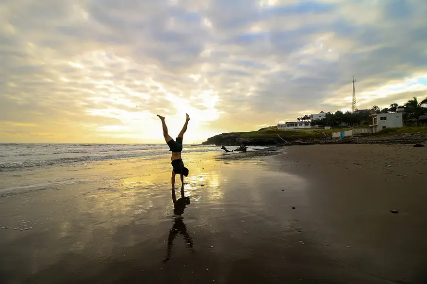 Yoga on the beach at sunrise